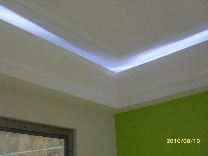 Green accent wall with LED cove lighting Las Vegas